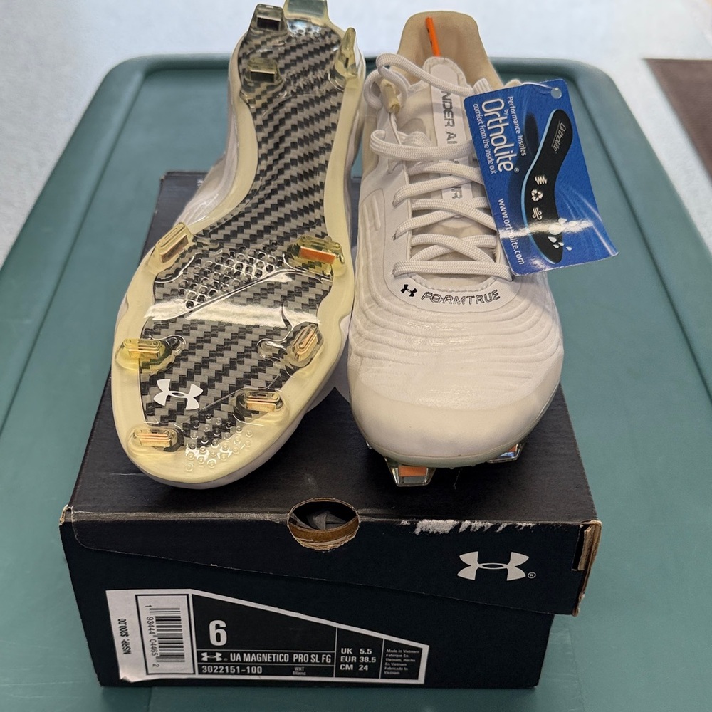 Under Armour Women’s White Soccer Cleats with clear/orange Studs